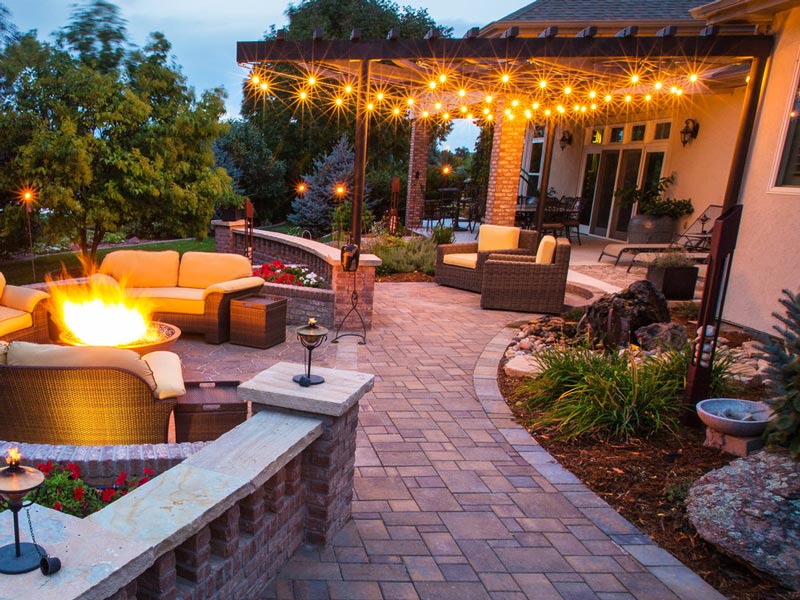 landscaping with firepit and pergola lighting